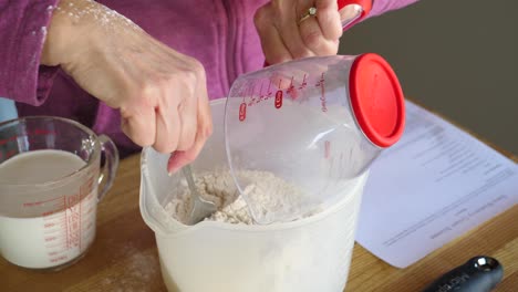 Adding-Ingredients-from-Measuring-Cup---Making-Scones-Slow-Motion