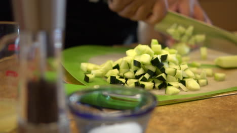 Woman's-Hands-Chopping-Cucumbers-On-The-Table---rack-focus