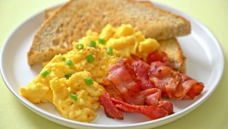 scramble-egg-with-bread-toasted-and-bacon-for-breakfast