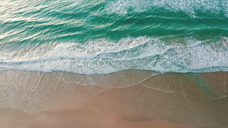 Top-down-drone-view-emerald-color-water-beach,-Brazil