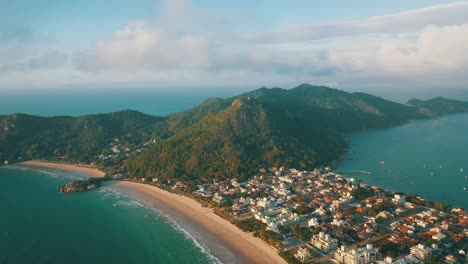 Drone-aerial-view-Monkey-Mountain-sunrise,-Canto-Grande-Beach,-Santa-Catarina,-Brazil