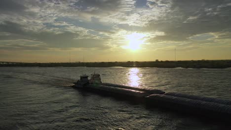 Sunrise-and-barges-on-the-Mississippi-River-in-New-Orleans