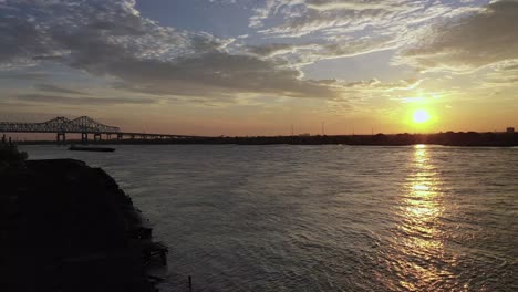 Aerial-video-of-push-boats-and-barge-on-the-Mississippi-River-in-the-mornings-beautiful-sunrise