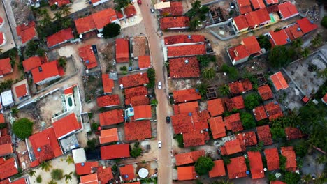 Aerial-bird's-eye-top-drone-following-shot-of-the-small-tropical-beach-town-of-Sibauma-in-Northern-Brazil-near-Pipa