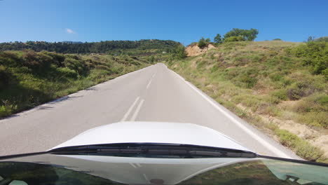POV-driver:-traveling-and-driving-on-straight-narrow-country-mountain-road-in-Peloponnese,-Achaia,-Greece
