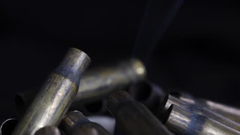 Close-up-of-a-pile-of-smoking-gun-shell-casings