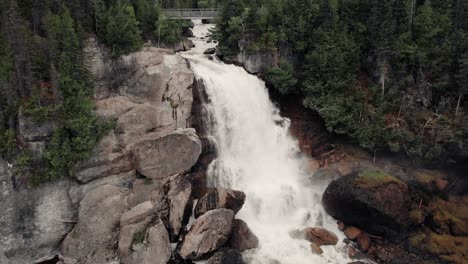Beautiful-And-Pristine-Chute-Neigette-Waterfall-Flowing-By-The-Green-Forest-At-Rimouski,-Quebec,-Canada