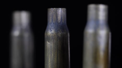 Close-up-rotating-shot-of-bullet-shells-standing-all-in-a-row