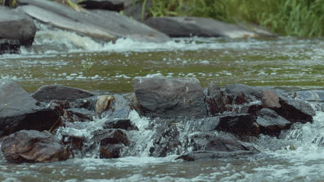 River-rapids-with-little-water-streams,-cinematic-slow-motion-closeup