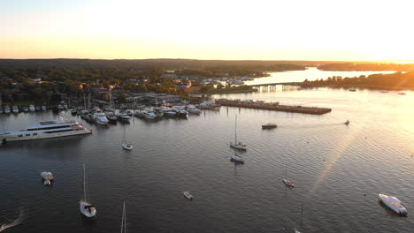 Aerial,-Boats-In-A-Harbour-At-Sunset-In-The-Beautiful-Hamptons