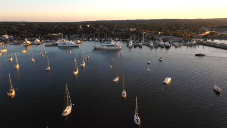 Sunset-Aerial-View,-Boats-In-Harbour-At-The-Hamptons,-New-York
