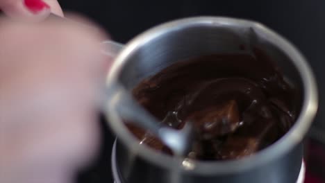 Melting-Chocolate-Bar-In-A-Small-Double-Boiler---close-up-slowmo