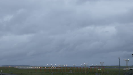 Plane-coming-into-land-at-Sydney-Airport-Australia-in-gray-stormy-weather-shot-in-4k-high-resolution