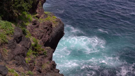 Tropical-Ocean-Waves-Breaking-On-The-Rocky-Cliffs-During-Summer