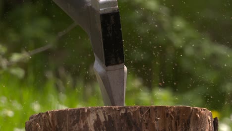 Log-splitting-with-axe-close-up-slomo