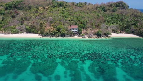 Aerial-View-of-Hidden-House-on-Exotic-Tropical-White-Sand-Beach-at-Romblon-Island,-Philippines