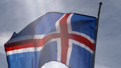 Iceland-flag-backlit-and-blowing-in-wind-in-slow-motion