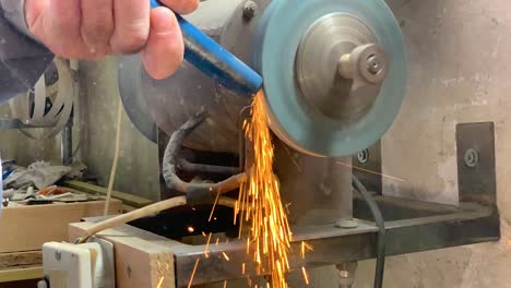 Grinding-metal-rod-on-a-metal-grinding-machine-in-super-slow-motion