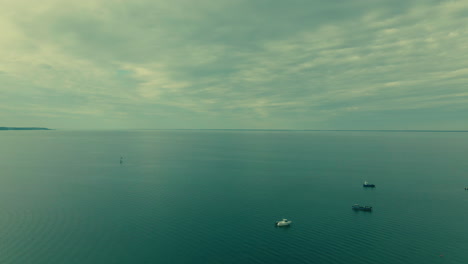 Aerial-panorama-shot-showing-endless-baltic-sea-and-driving-boats,Poland