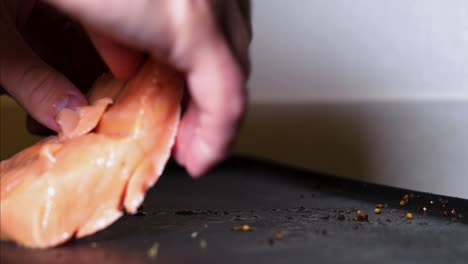 Raw-fresh-salmon-fillet-placed-onto-hot-pan,-home-cooking,-slow-motion-closeup