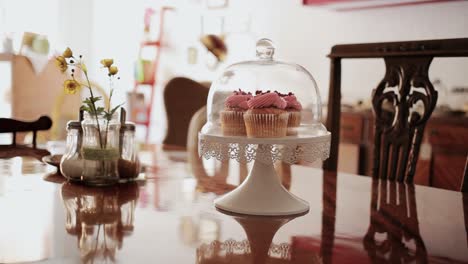 Home-made-tasty-delicious-fresh-colorful-cupcake-at-home-old-vintage-table-medium-shot-during-day-time