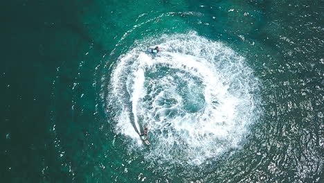 Aerial-Shot-Of-Two-Jetsurf-Riders-Performing-Tricks-In-Beautiful-Ocean