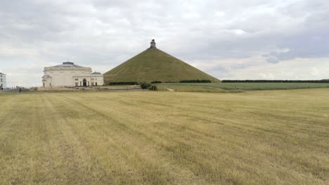 Aerial-of-the-Lion's-mound-around-arable-land-and-next-to-the-museum-of-Waterloo