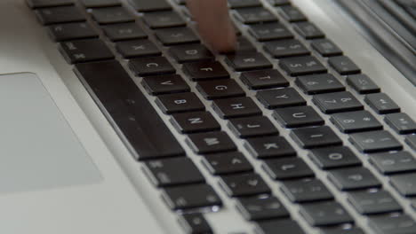 Single-finger-typing-on-laptop-keyboard