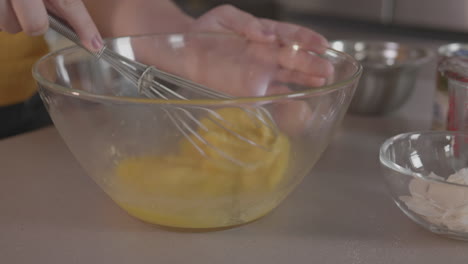 whisking-eggs-in-a-clear-mixing-bowl