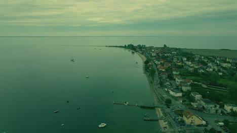 Aerial-view-showing-coastline-of-Rewa-in-Poland-with-boats-during-cloudy-day