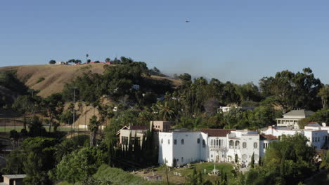 Helicopter-firefighting-brush-fire-in-eastern-Los-Angeles-Lincoln-Heights-suburb