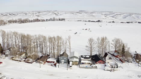 The-Wonderful-Location-For-Ice-Fishing-In-Lac-Pelletier-Saskatchewan,-Canada-During-Winter---Aerial-Shot