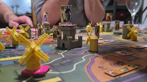 Fief-Board-Game---Players-taking-The-Components-of-The-Game-Board