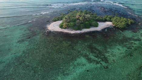 Isolated-Uninhabited-Tropical-Island-With-Lush-Vegetation-and-White-Sand-Beach
