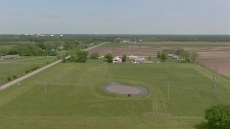 Aerial-view-of-ATV-at-the-pond-at-a-farm-house-in-Kansas