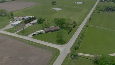 Aerial-view-pans-around-Country-home-in-Kansas