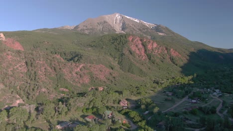 Aerial-view-moves-away-and-down-at-Mount-Sopris-Carbondale-Colorado