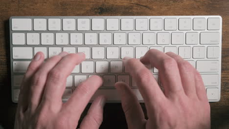 Closeup-view-of-caucasian-hands-typing-a-fast-text-on-keyboard-at-college