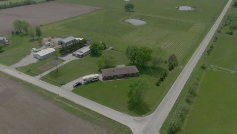 Aerial-view-moves-down-Country-road-in-Kansas