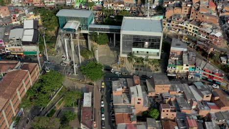 Aerial-View-of-Metrocable-Gondola-Station-Surrounded-by-Poor-Neighborhood-in-Medellin,-Columbia