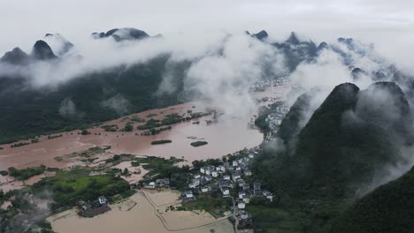 China-natural-disaster,-flooding-in-Yulong-River-mountain-landscape,-Guangxi,-aerial