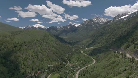 The-aerial-view-moves-down-to-show-a-view-of-beautiful-winding-Colorado-road