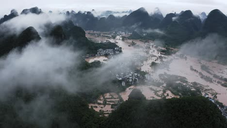 China-flooding-in-remote-karst-mountain-landscape,-Guangxi-natural-disaster,-aerial