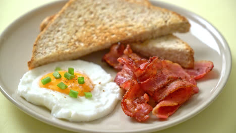 fried-egg-with-bread-toasted-and-bacon-for-breakfast