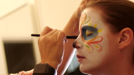 Profile-of-Woman-having-Catrina-Day-of-the-Dead-Makeup-Applied