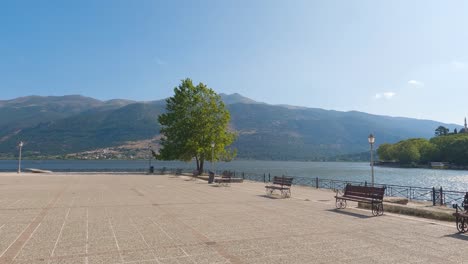 Wide-Promenade-With-Empty-Seat-Benches-Beside-Lake-In-Ioannina,-Greece