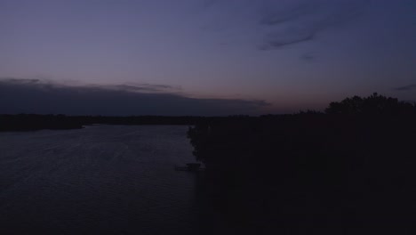 Rising-aerial-shot-of-a-beautiful-Midwestern-lake-during-twilight