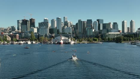 Aerial-view-pulling-away-from-downtown-Seattle-with-boats-filling-South-Lake-Union