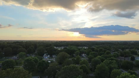 Flying-over-some-houses-during-sunset-in-Clarksville,-Tennessee