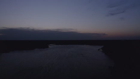 Aerial-descending-shot-shot-dollying-across-lake-at-twilight